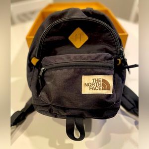 The North Face Mini backpack purse. Black canvas.